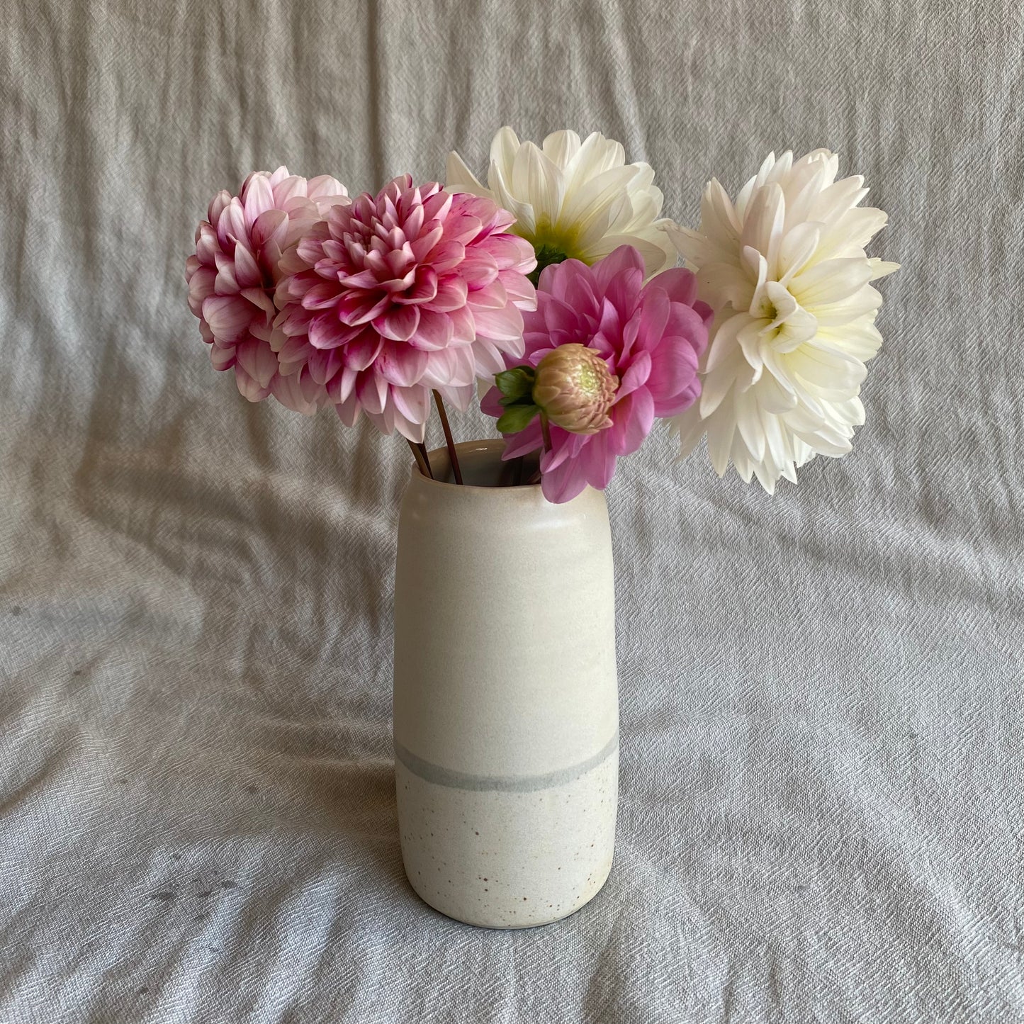 matte white vase with speckle and blue
