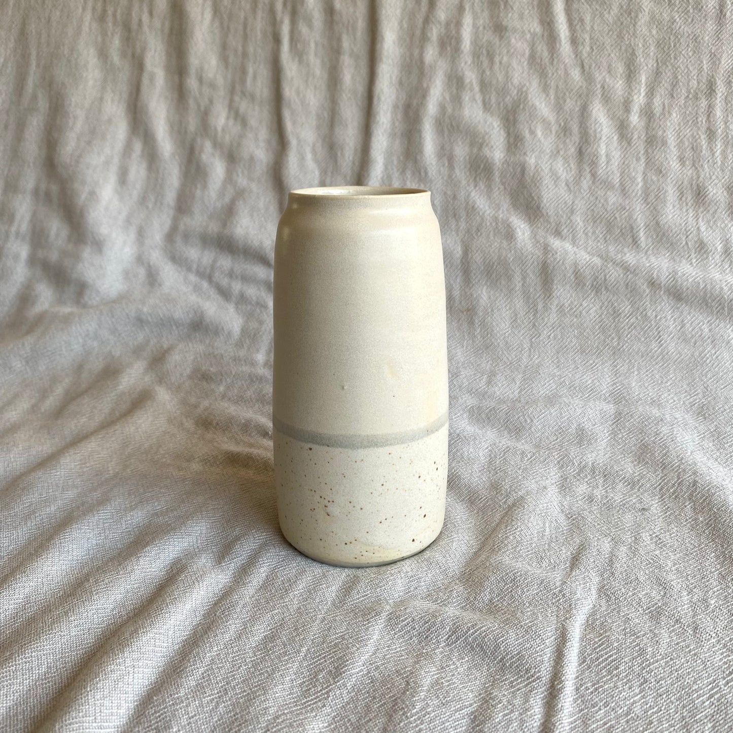 matte white vase with speckle and blue